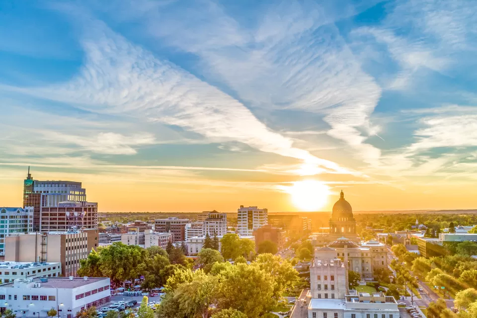 View of Boise, Idaho timeline with state capitol dome against early sunset sky